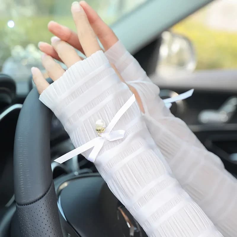 Guanti lunghi sottili con fiocco di perle moda donna Estate guida ciclismo Protezione solare sexy Guanti elastici anti-UV Scaldamuscoli con protezione solare Nuovo