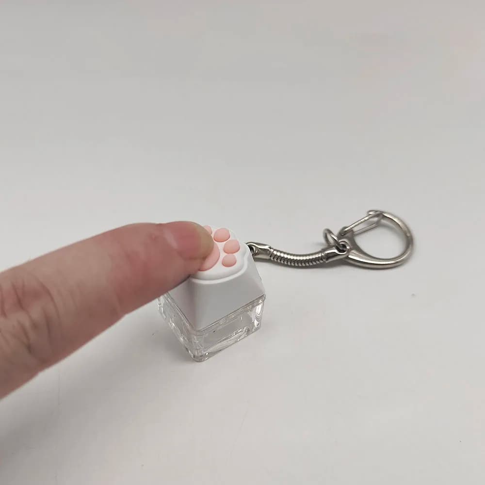 Keychain shaped as a cat's leg, antistress for fingertips, key tester, backpack pendant, gift for festival couples