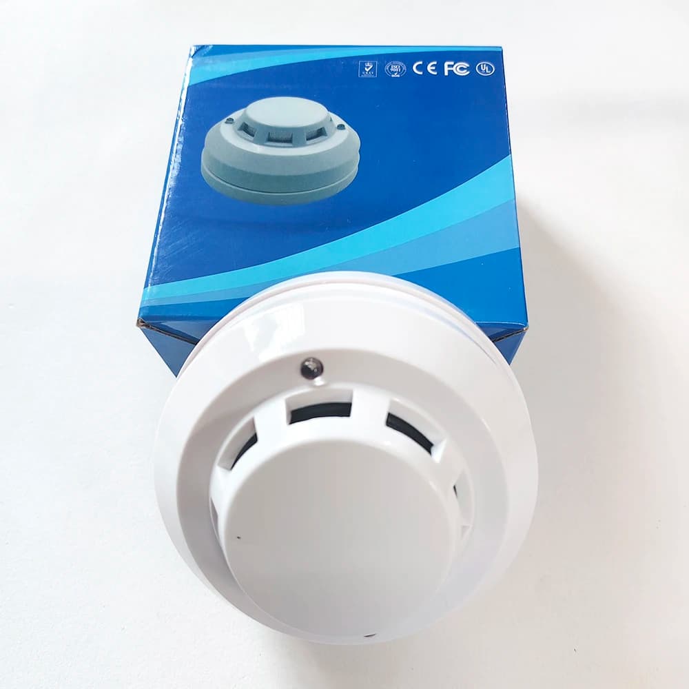 Il trasmettitore del sensore di fumo interno cablato di tensione DC12V-24V raccoglie il sensore di allarme del rilevatore di fumo autonomo per il sistema di allarme Gsm