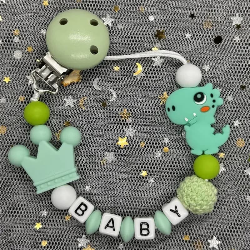 Vendita calda Nome personalizzato personalizzato Porta ciuccio fatto a mano Porta ciuccio in silicone Dinosauro Catena per ciuccio Massaggiagengive per bambini Catena per massaggiagengive Regalo