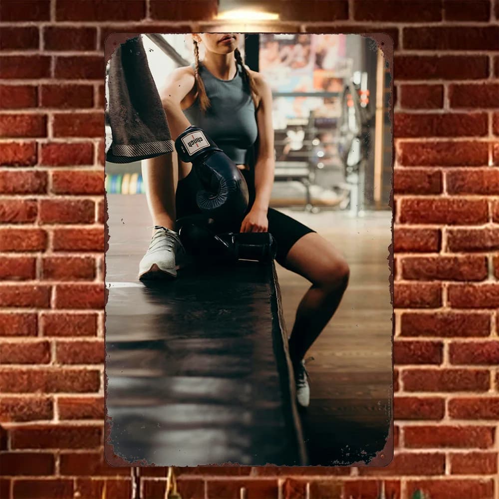 HD metal plate, wall decoration with female boxer with gloves resting in the gym, for the home gym