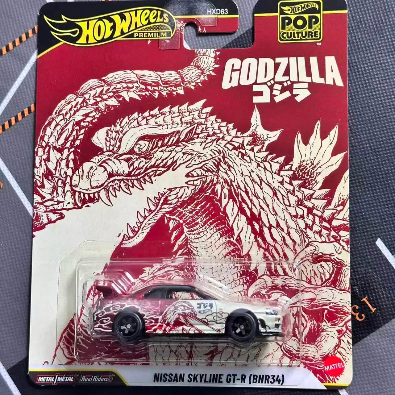 Modellino Auto Hotwheels Premium in Metallo Nissan Skyline Gtr Bnr34 Godzilla Pop Culture Real Riders da Collezione HXD63 per Hobby Adulti