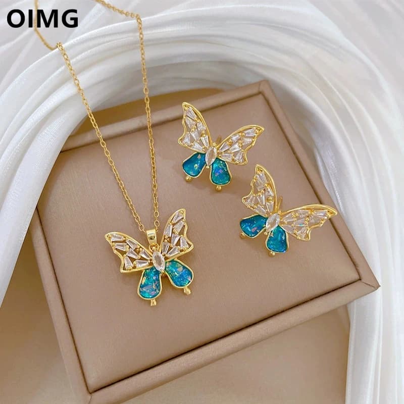 OIMG 316L Estetica in acciaio inossidabile Cristallo blu Collana con pendente a farfalla cava Orecchini per le donne Set di gioielli di moda regalo