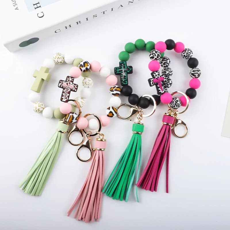 Portachiavi con perline, braccialetto in silicone con croce elastica, anello portachiavi da polso, nappa, bracciale portachiavi per auto, da donna