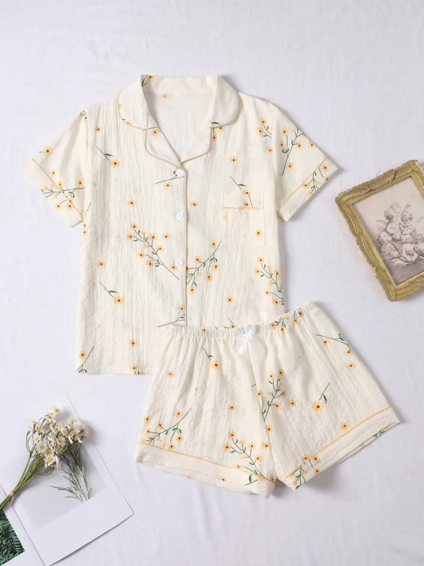 Women's pajamas set in two pieces with floral print, short sleeve top and shorts, summer comfort