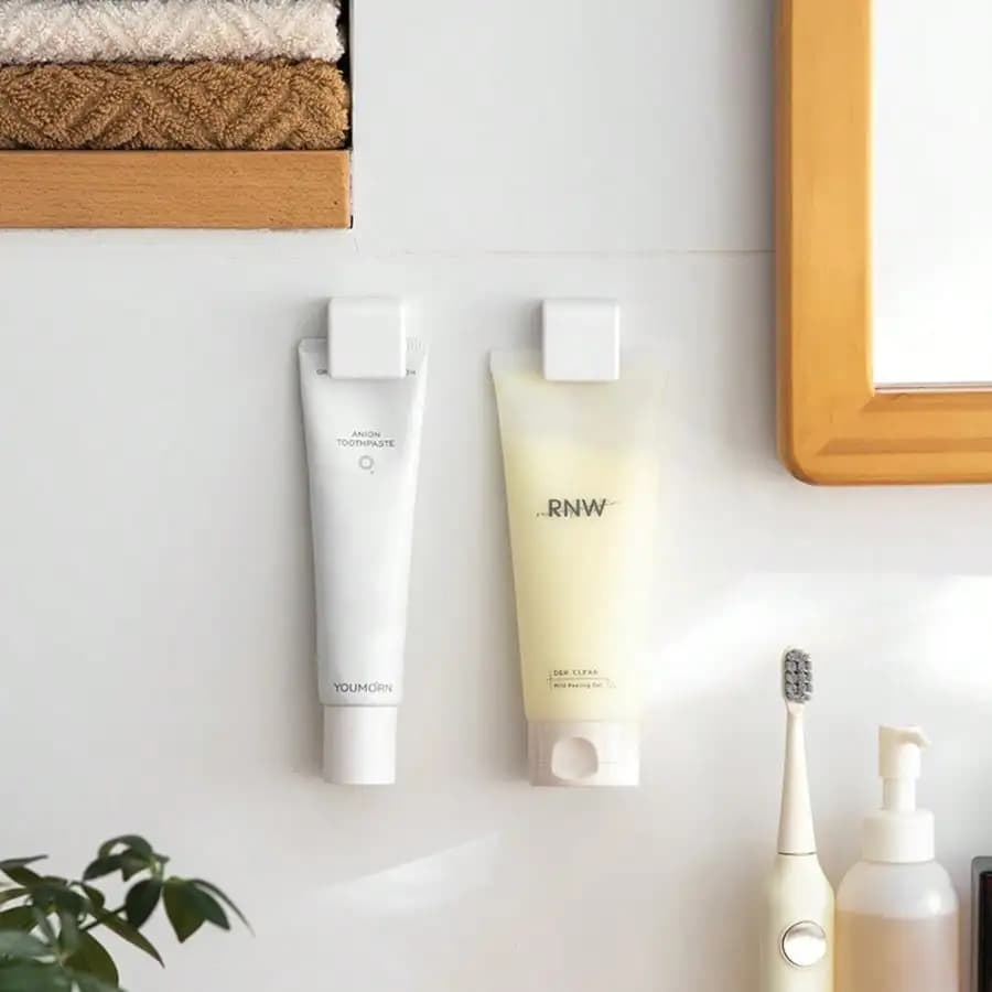 Minimalist Multi Purpose Wall Mount Tube Organizer Clip Sleek White Bathroom Wall Rack for Skincare and Toothpaste Damage Free Hanging Hook Aesthetic Home Organization Storage