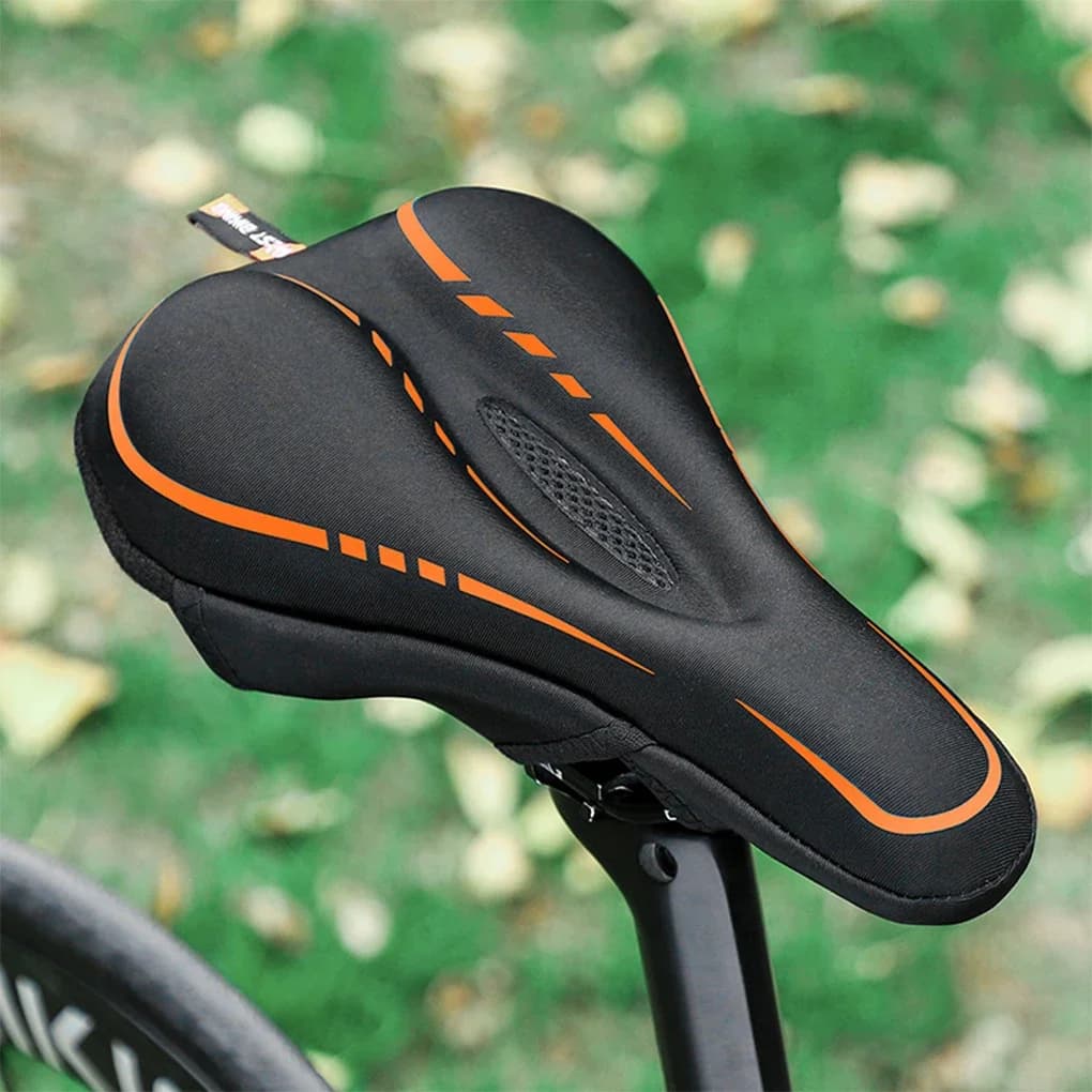 Coprisedile per bicicletta cavo in spugna di memoria in silicone addensato Comfort istantaneo Aggiornamento leggero Coprisella per bicicletta Arancione Nero