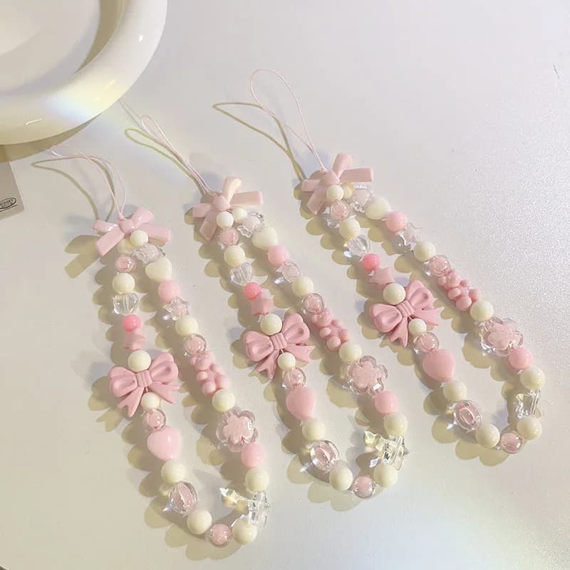 Catenella per cellulare con fiocco rosa, orsetto, stella e fiore, con perle, per donne e ragazze, accessorio anti-smarrimento.