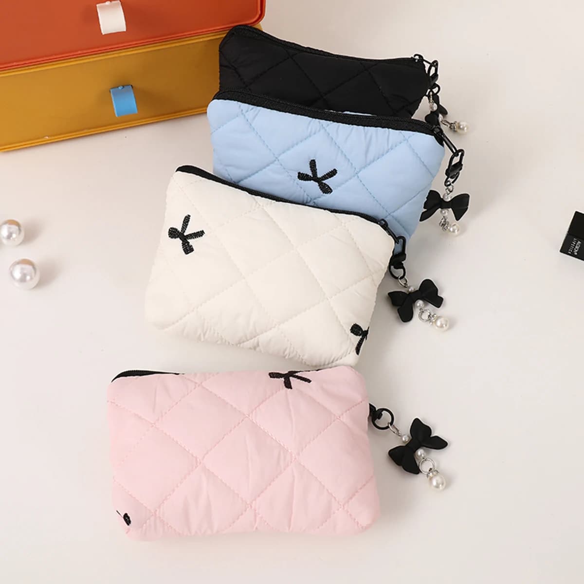 Borsa per il trucco con fiocco trapuntato, custodia da viaggio portatile per rossetti, auricolari e piccoli oggetti, squisita pochette portatile