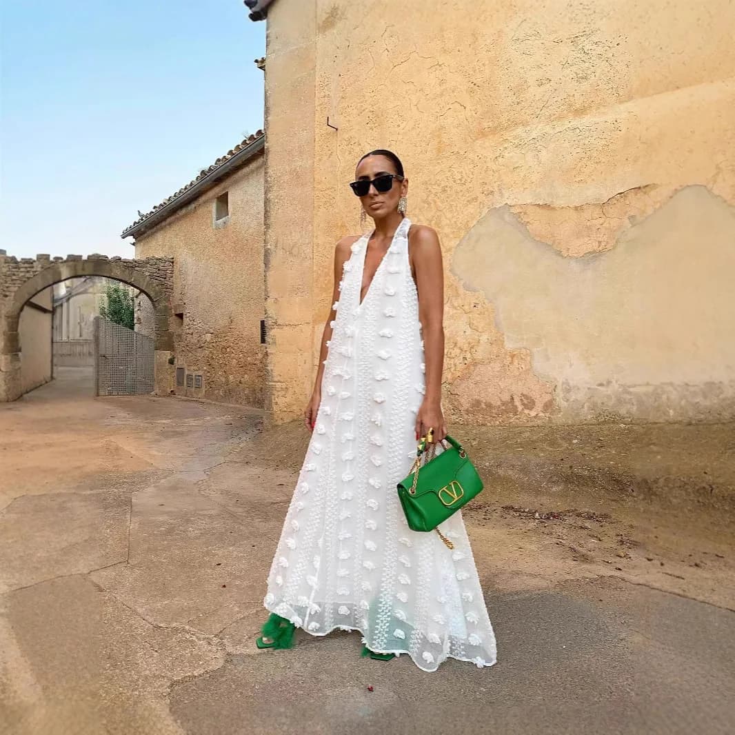 Abito da donna nuovo stile festivo 2026 con scollo a V e fiore tridimensionale a pendolo