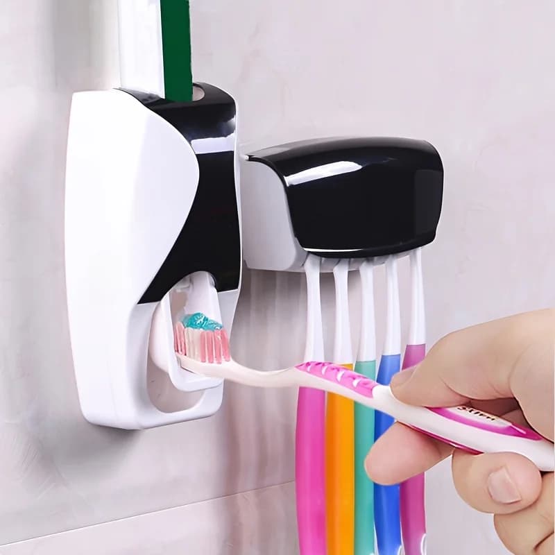 Un set di portaspazzolino da parete con dentifricio automatico: dispositivo di spremitura, accessorio da bagno.