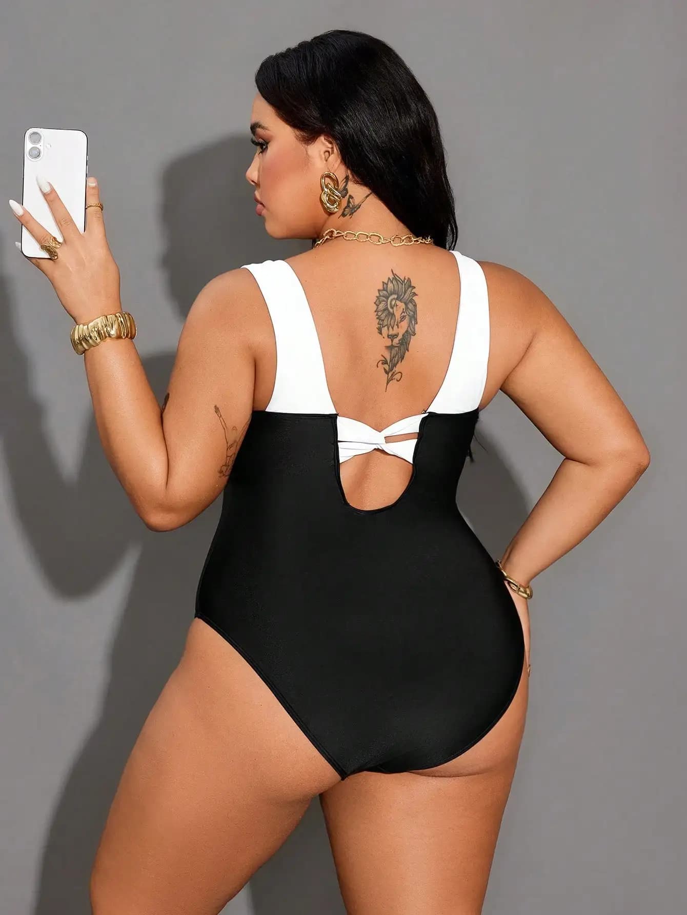 Contrast black and white swimsuit, strong sizes, with dug back and belly control, for the beach