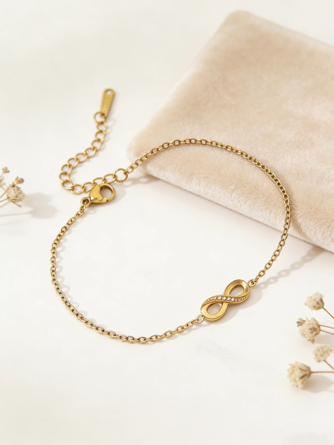 Minimalist women's bracelet, high-end, 18K gold plated stainless steel with diamonds and infinite symbol.