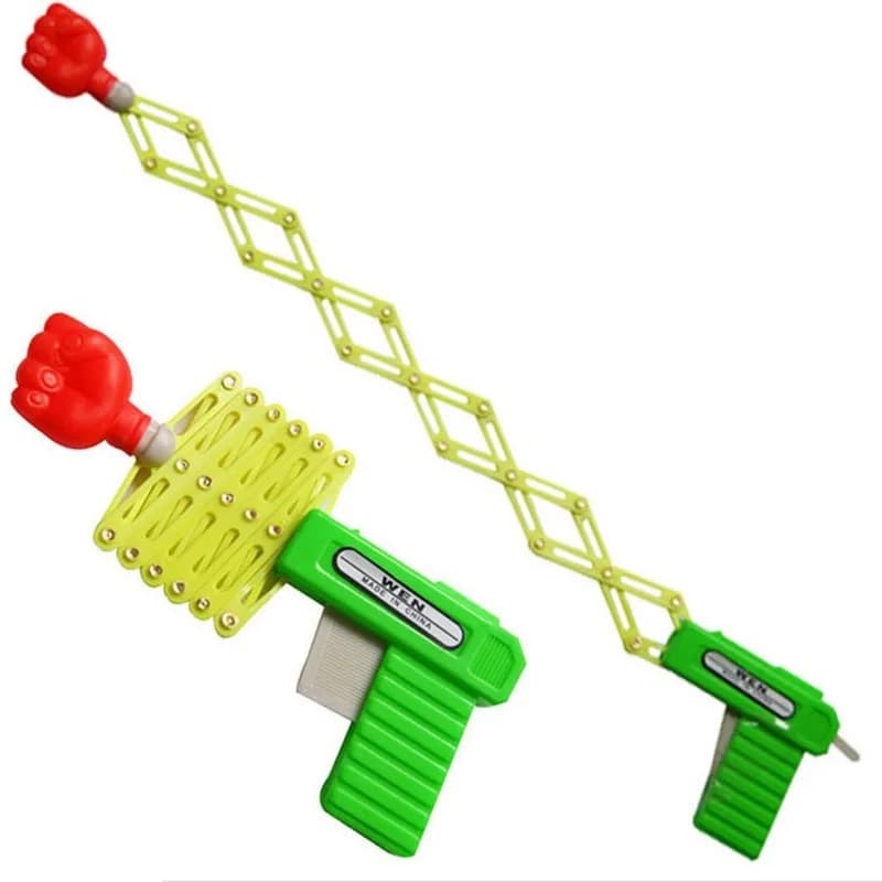 Pugno retrattile Sparatutto Pistola giocattolo Divertente Scherzo per bambini Giocattoli Regalo di festival in plastica per bambini per divertimento Pugno telescopico elastico classico