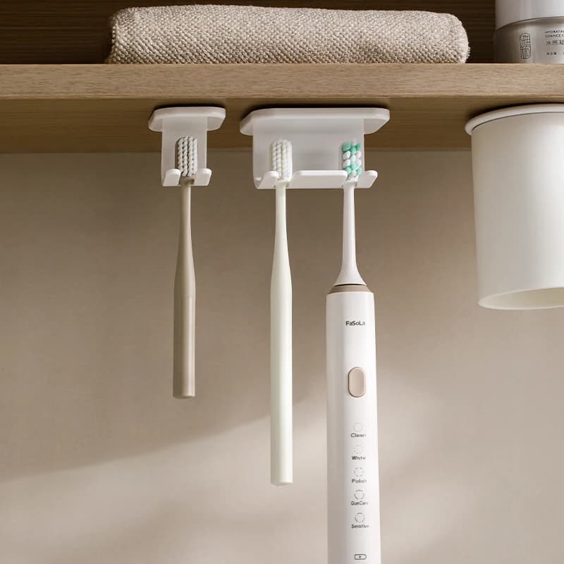 Detachable self-adhesive toothbrush holder for plastic holder for electric toothbrush mounted to the bathroom wall