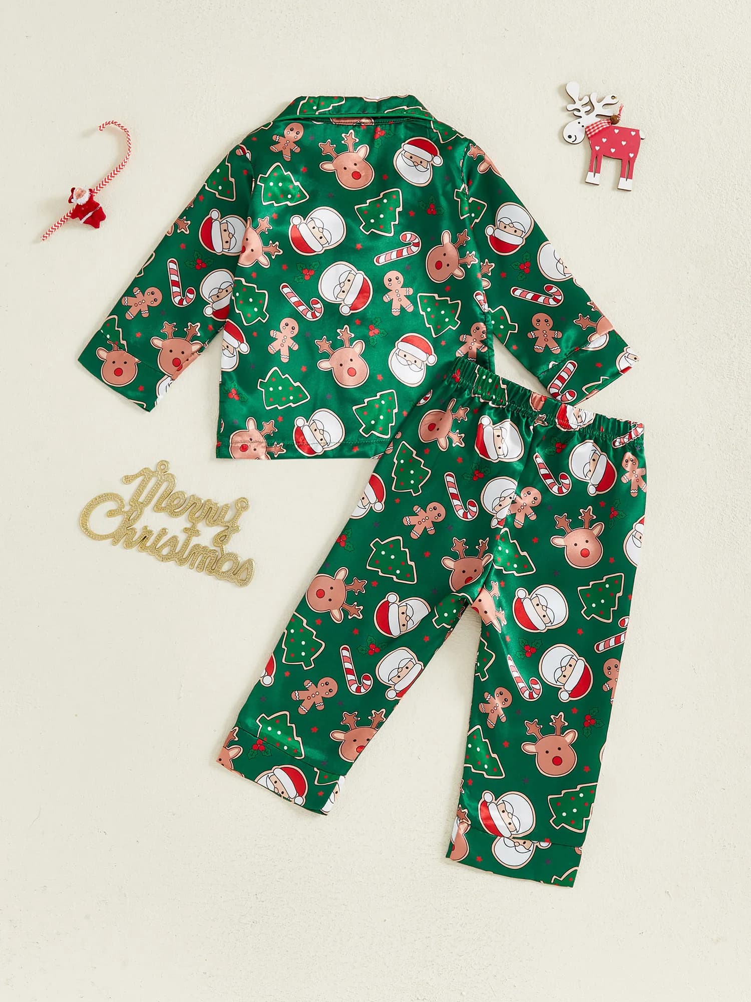 Nice Christmas baby pajamas with festive print, buttons on the back, V neckline, long sleeves, tops and trousers for children