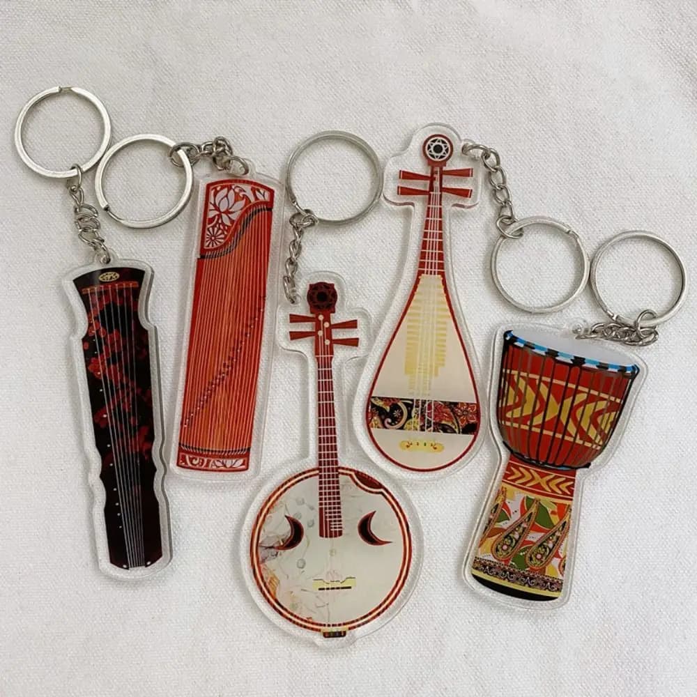 Portachiavi in acrilico a forma di ukulele, violino, violoncello, chitarra, clarinetto, batteria e chitarra elettrica