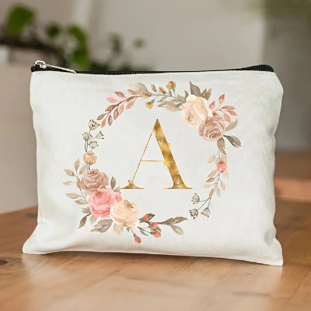 A make-up bag with floral aesthetic pattern characterized by 26 letters of the alphabet, perfect as a gift for bridesmaids, teachers and