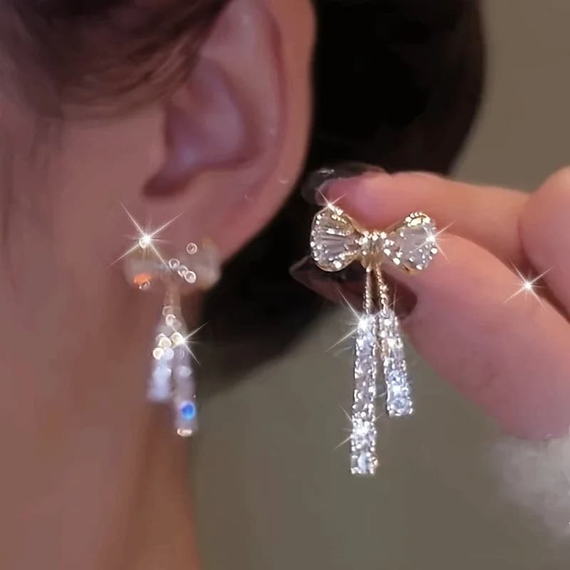 Eleganti orecchini pendenti con fiocco e zirconi scintillanti - gioielli in lega alla moda da donna per l'uso quotidiano e occasioni specialijvv