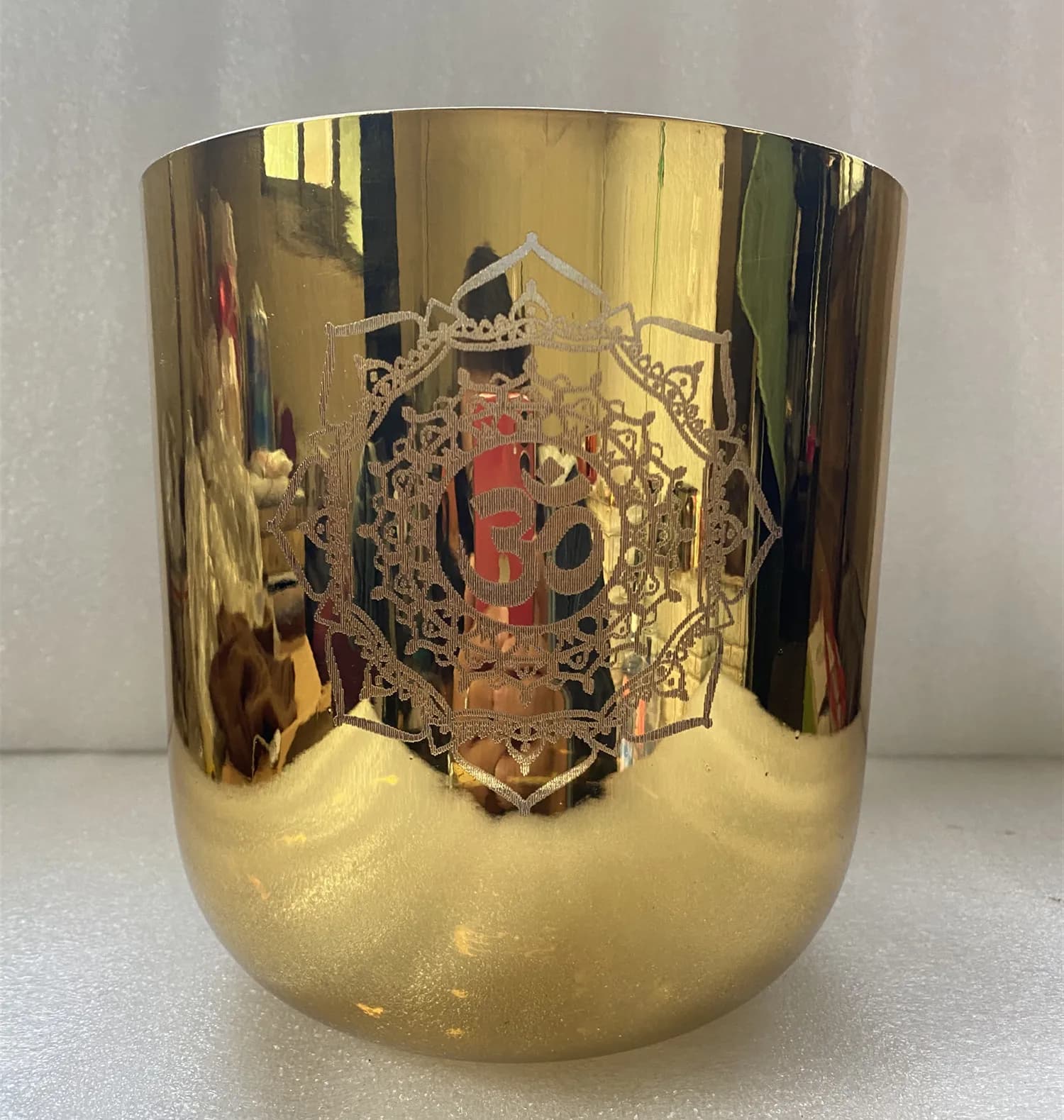 432Hz golden Crystal singing bowl 3rd octave E note Solar Plexus chakra or F note Heart chakra OM engraving for sound healing.