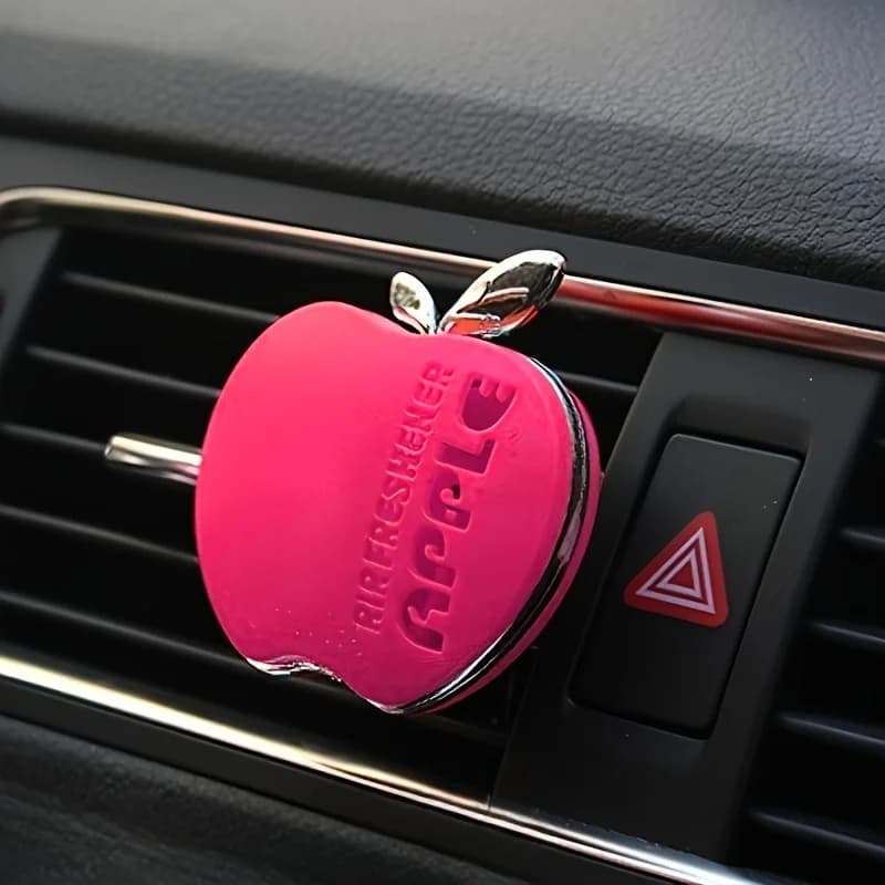 An apple-shaped car deodorant with floral fragrance - equipped with a decorative design with ventilation clip
