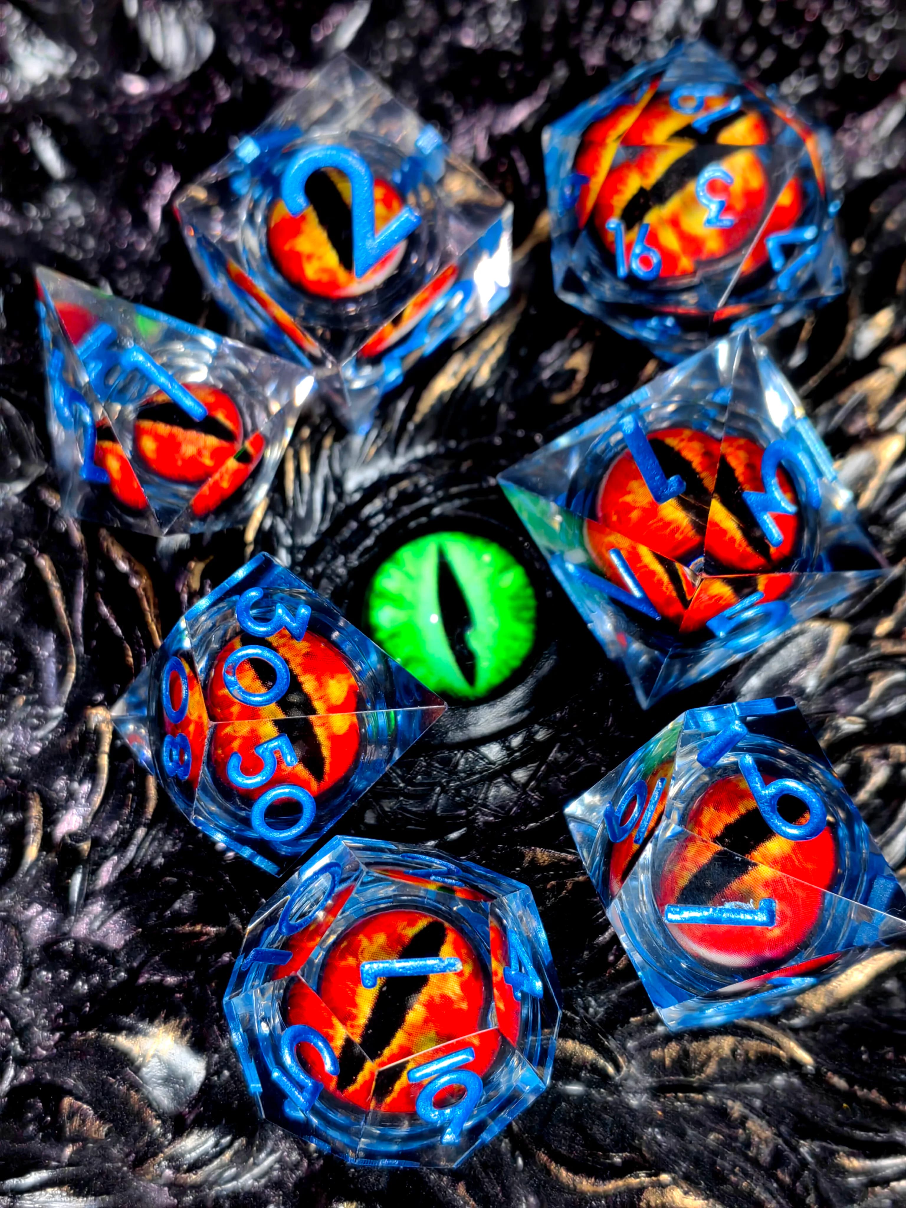 DnD Dice Set - 7-Piece Resin Dice with Spinning Dragon Eye Core, Transparent Blue Lettering for Tabletop RPG & Board Games