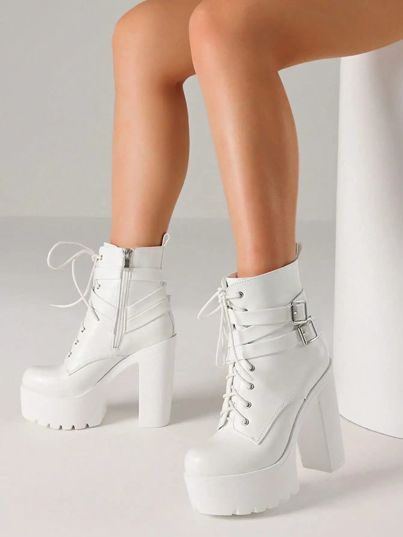 Elegant women's ankle boots with buckle fastened with big heel and woman's plateau, luxury cool fashion punk winter shoes