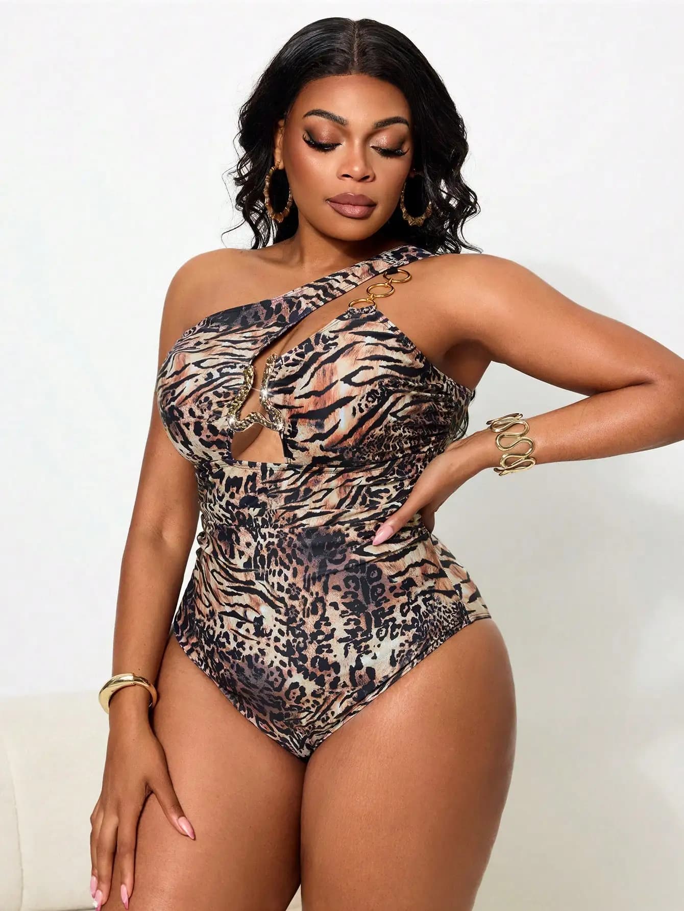 One-stop swimsuit with animal print, cut-out on the chest and golden ring detail