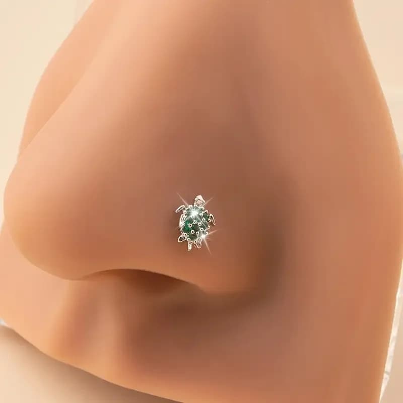 A Fashionable And Unique Nose Stud With Zirconia Inlay, In The Shape Of A Pierced Turtle Nose Ring Made Of Stainless Steel