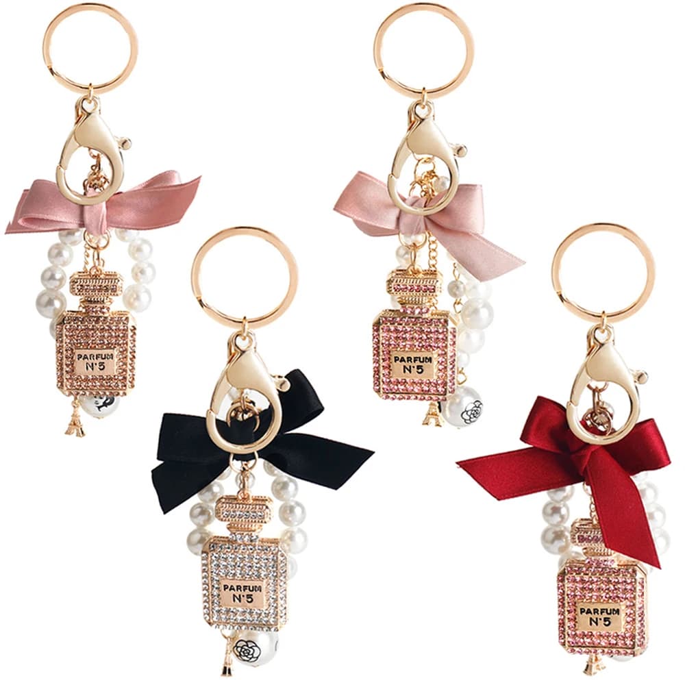Moda imitazione perla bottiglia di profumo portachiavi portachiavi auto borsa da donna accessori con ciondoli portachiavi con fiocco carino portachiavi creativi