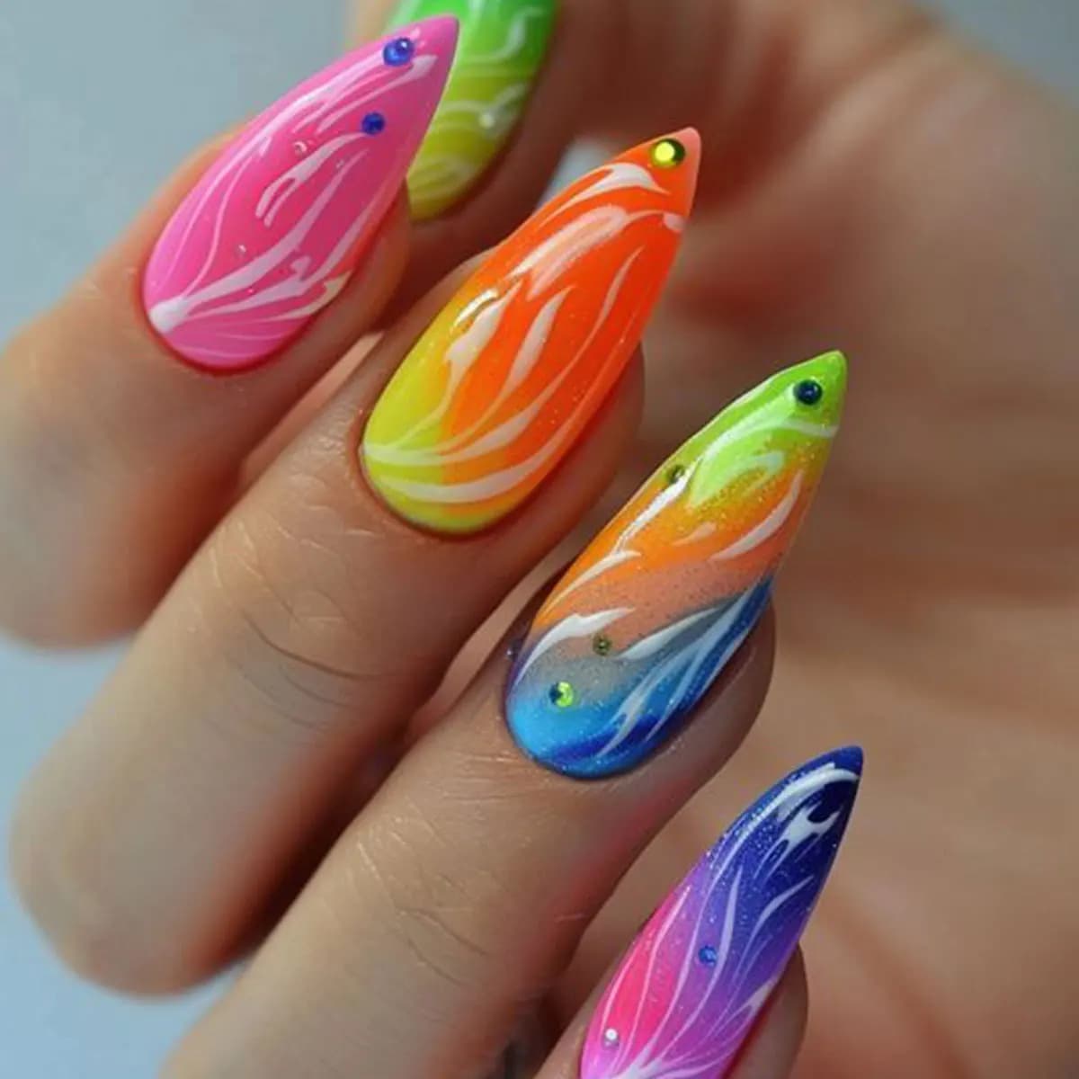 Press on fingernails fake nails to Stiletto along fake nails green glittered glue on nails with snake drawings and rhinestones almond nails