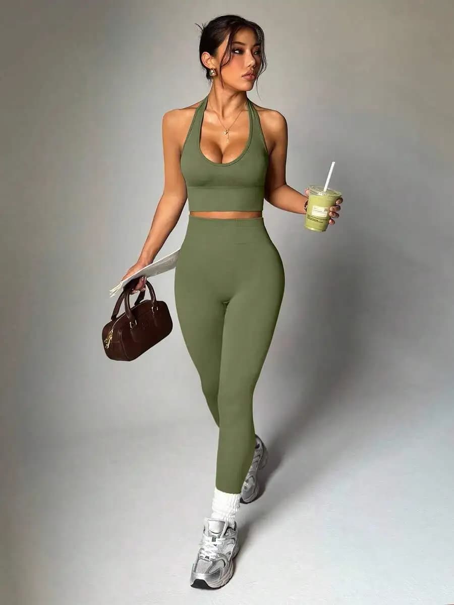 Set sportivo da donna con top corto a tinta unita con collo all'americana e leggings a vita alta