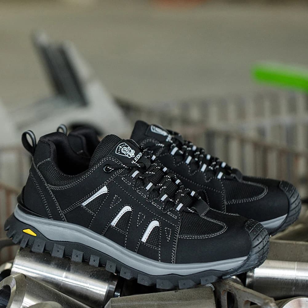 Scarpe con punta in acciaio Scarpe da lavoro comode Scarpe da ginnastica resistenti alle coltellate Scarpe da ginnastica di sicurezza con lacci per costruzioni industriali