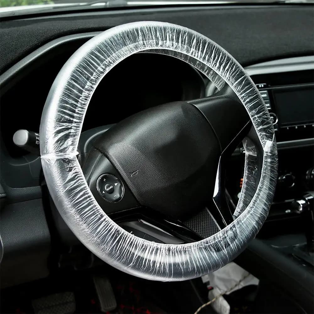 Coprivolante universale usa e getta per auto da 50 pezzi Coprivolante trasparente Protezione isolante di sicurezza in plastica impermeabile elastica