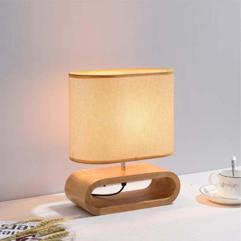 Lampada da tavolo in legno nordico creativa moderna camera da letto comodino luce a LED soggiorno Hotel studio giapponese lampada da tavolo paralume in lino