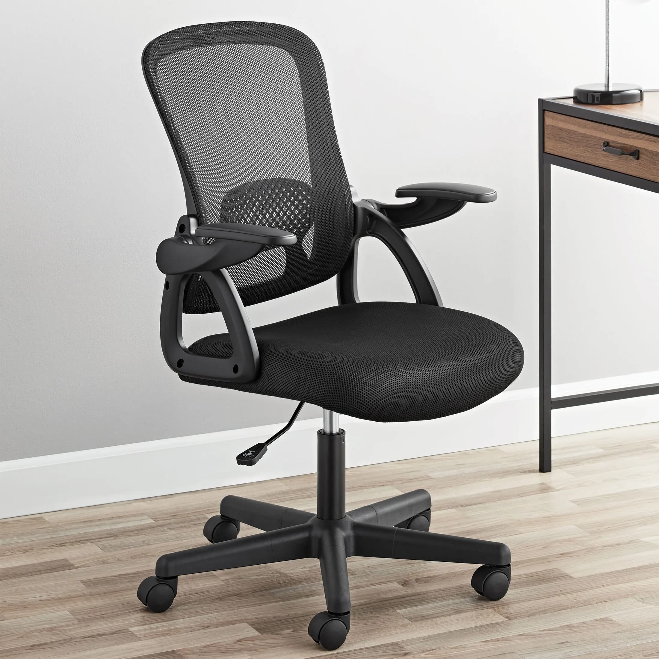 Ergonomic mesh back office chair with flip-up arms black fabric seat weight capacity 275 lbs
