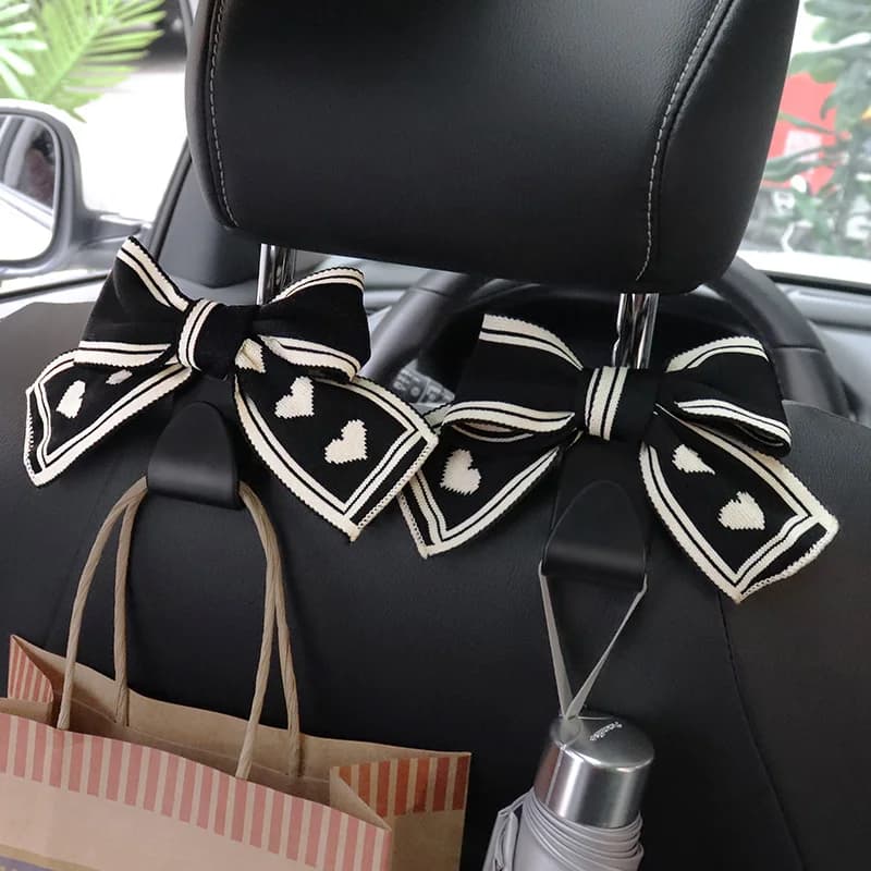 Universal Lover Bowknot ganci per auto sedile posteriore veicolo poggiatesta Organizer gancio di stoccaggio generi alimentari borsa donna accessori per auto