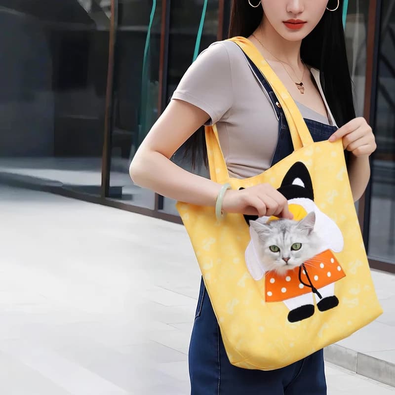 A lightweight dog handbag suitable for small dogs and cats weighing less than 15 pounds, featuring a padded pet bag style dog