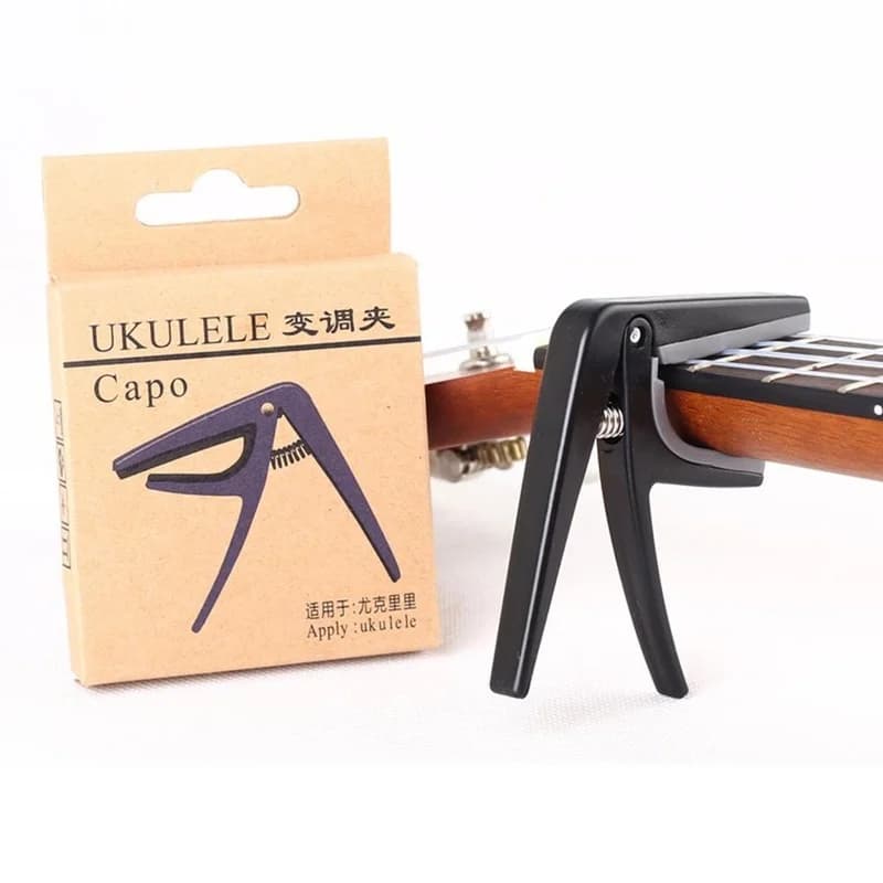 Ukulele professionale Capo 4 corde Hawaii Capos per chitarra cambio rapido con una sola mano parti e accessori per chitarra