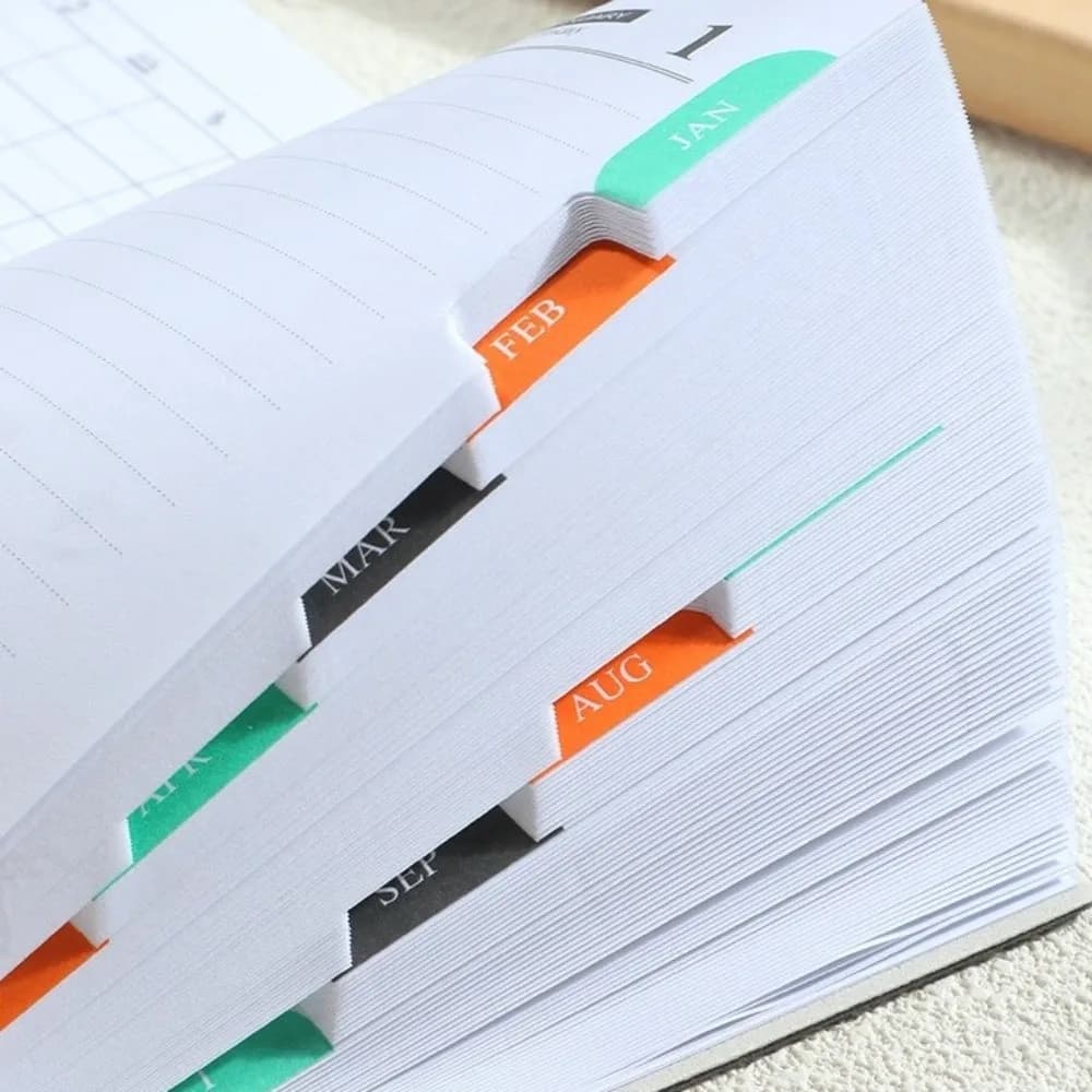 A6 Daily Planner Notebook PU Leather 2027 English Yearly Agenda with Colorful Month Index Tabs Travel Planning Journal