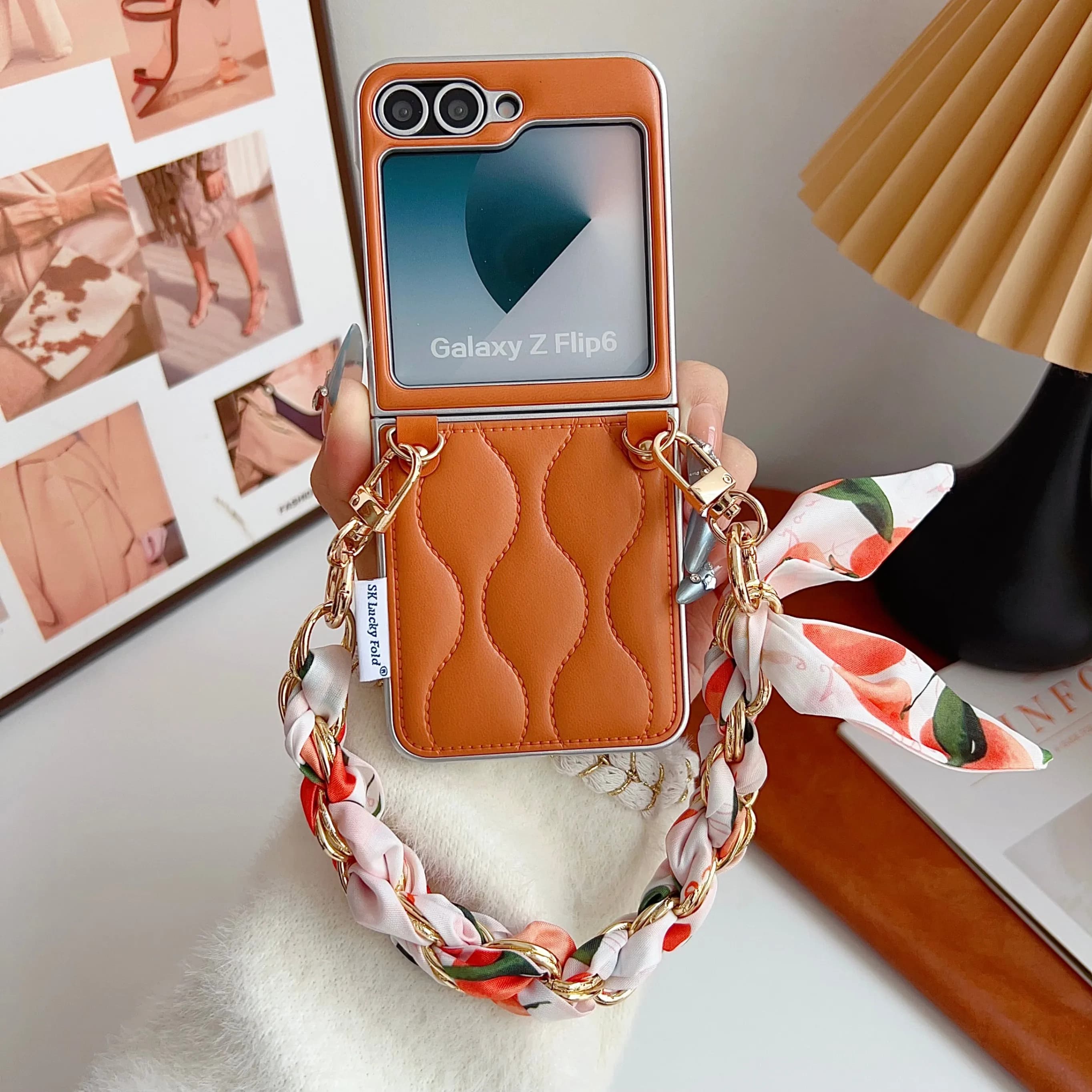 New case for Samsung Galaxy Z Flip7 FE with orange duvet design and silk fabric chain