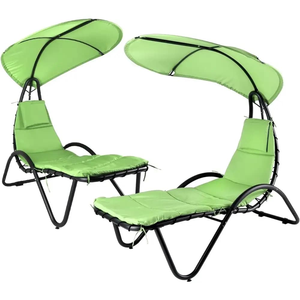 Green outdoor chaise longue with hanging hammock, sunshade, large umbrella and pillow for relaxation in the courtyard or on the pool edge