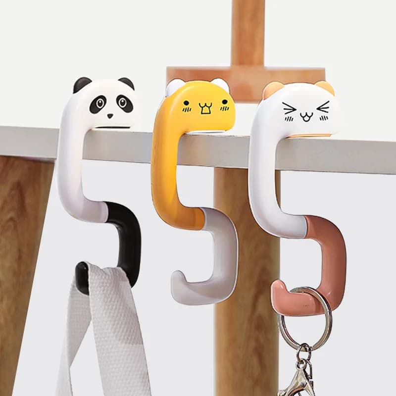 Foldable hook in the shape of animated cardboard, without drilling and without leaving marks, to hang backpacks, keys, shopping bags, table, non-slip and durable.