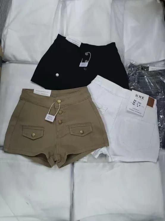 Summer vintage denim shorts, high waist, with multiple buttons, slim fit hotpants, modelling, push-up, casual