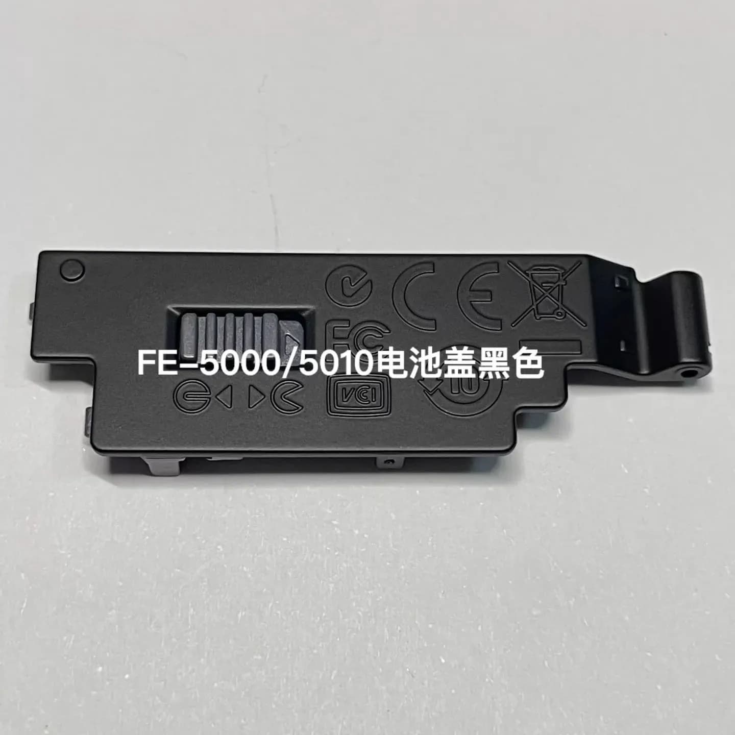 Nuove parti di ricambio originali per la riparazione del coperchio della batteria per la fotocamera Olympus FE-5000/5010