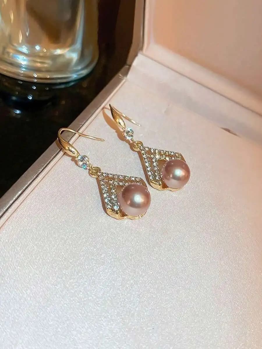 Champagne pearl earrings featuring fashionable minimalist design and premium aesthetic appeal