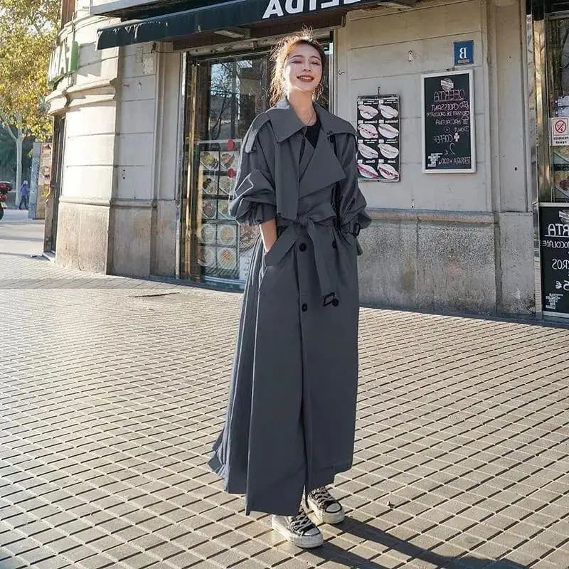 Autunno Inverno Trench lungo kaki per donna 2026 Giacca elegante tuta sportiva Colletto rovesciato Cintura con cravatta Giacca a vento chic coreana