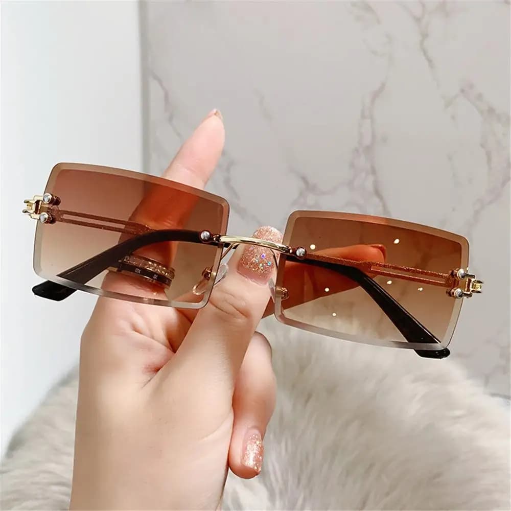 Occhiali da sole rettangolari UV400 con montatura in metallo ultraleggero Occhiali da sole per donna Occhiali da sole vintage Occhiali da sole senza montatura