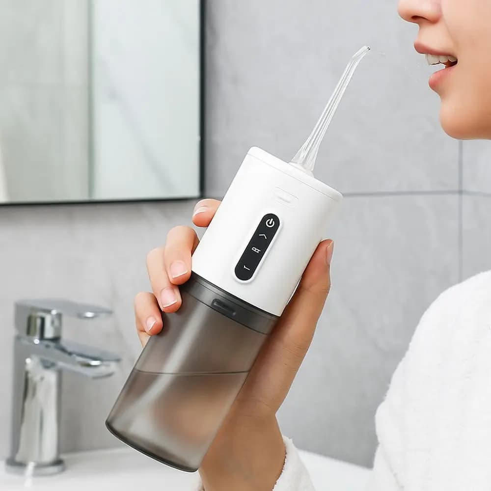 Irrigatore Orale Professionale con Ricarica USB, Pulitore Dentale Portatile a Tre Frequenze, Spazzolino Elettrico da Viaggio