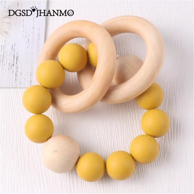 Bracciale massaggiagengive con sonaglio per bambini Perline in silicone per uso alimentare Ciondolo a forma di anello in legno Dentizione per accessori per passeggino da masticare Giocattoli